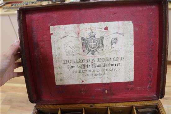 A Holland and Holland leather covered oak ammunition box length 41cm